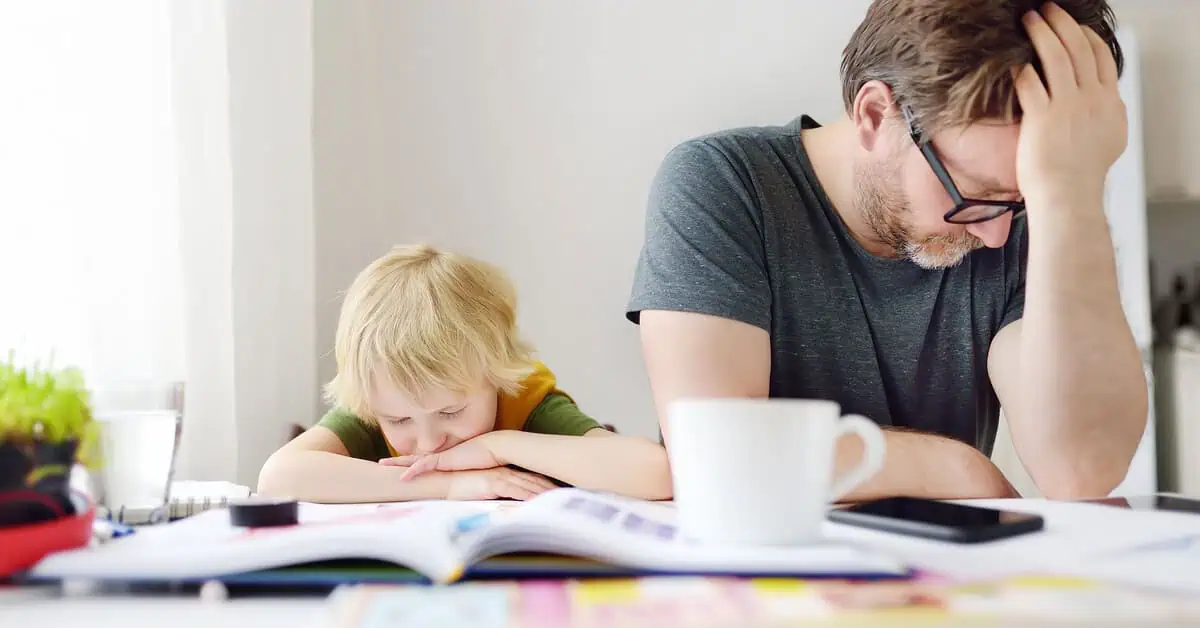 Frustrated father and child sitting at a cluttered table—highlighting how ADHD can affect both parenting and learning. Strategic Hypnotherapy from Mindshift Mentors offers support for emotional regulation and family balance.