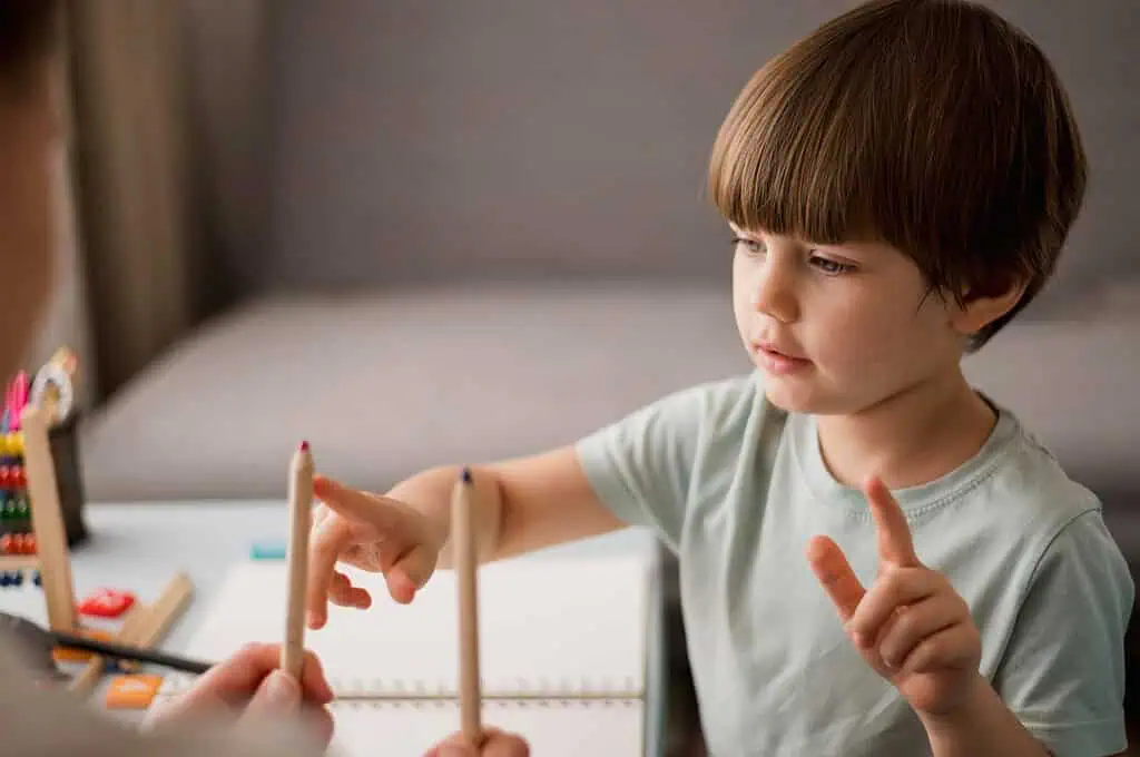 A young boy participating in a coordination assessment activity, highlighting motor skill challenges linked to Developmental Coordination Disorder (DCD).