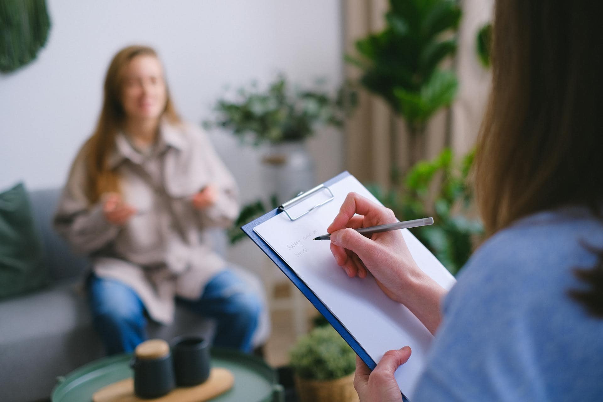 Woman talking to a therapist during a counseling session, symbolizing mental health support for women in emergency services